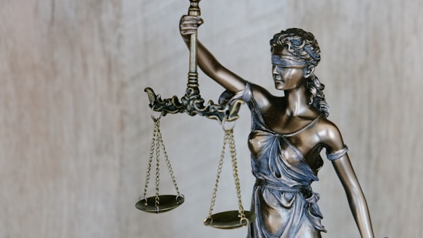 Criminal defense law books and gavel